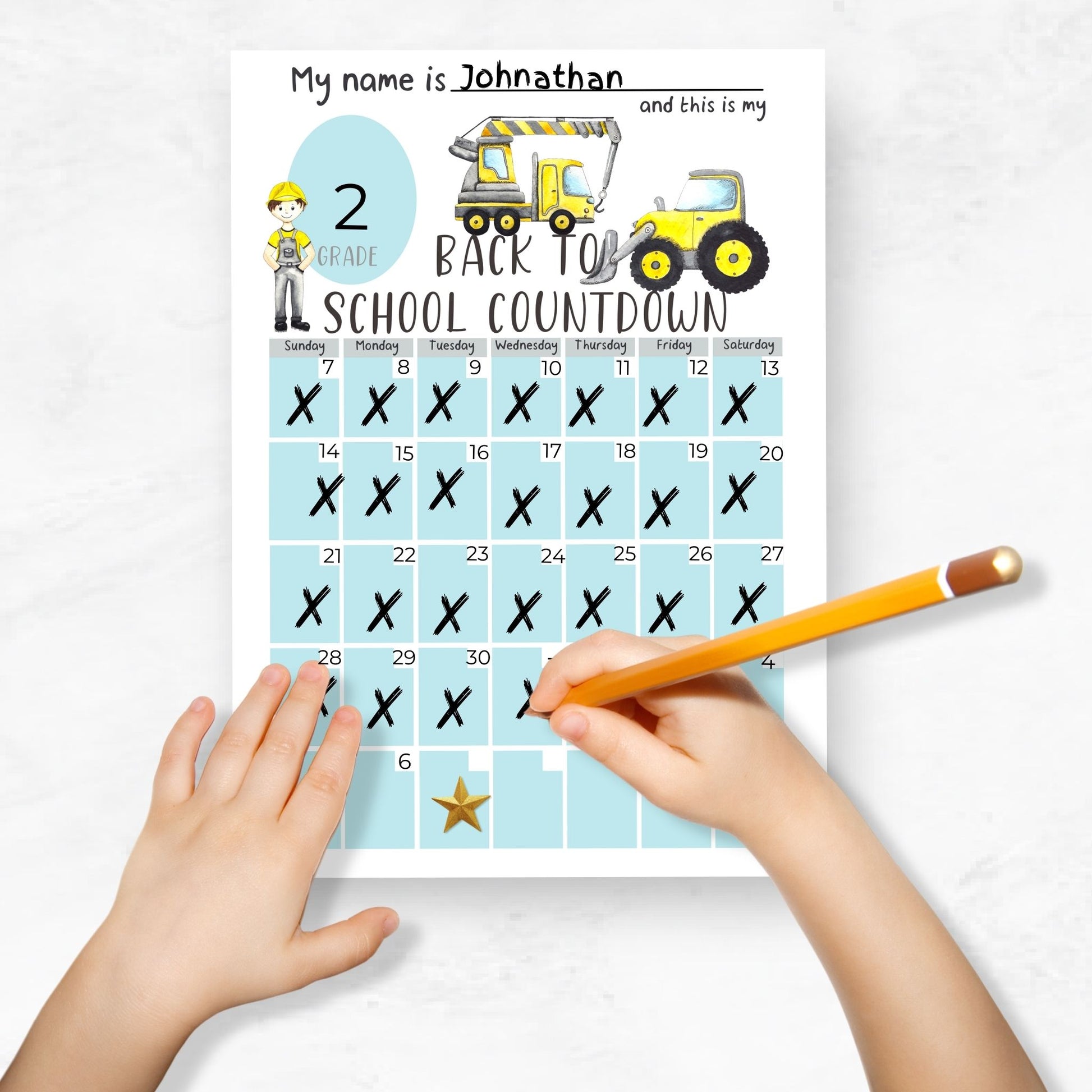 mockup image of a childs hands holding a pencil. Child is filling in a back to school countdown printable 