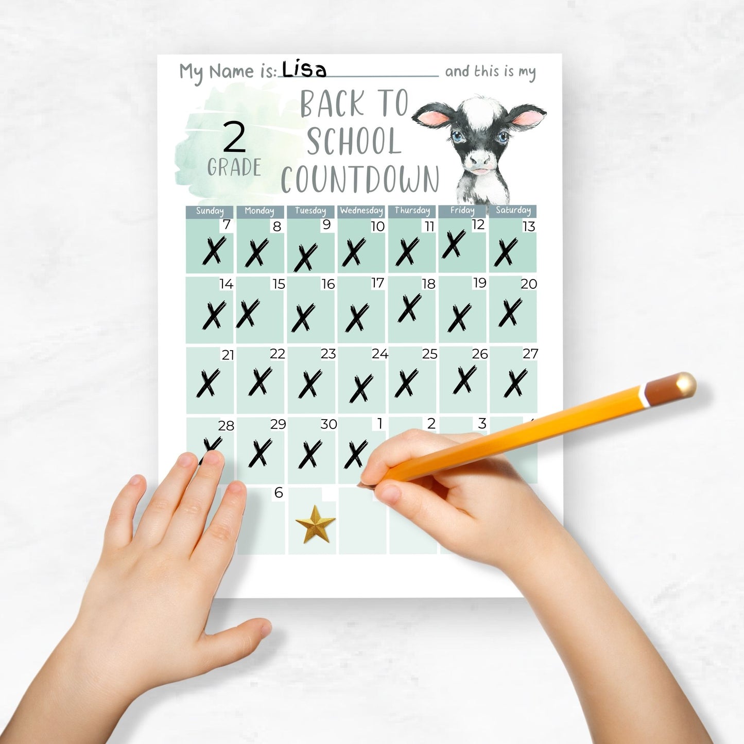mockup image of a child's hands holding a pencil and filling in the school countdown calendar ombre calf with her information. Marking off the days with an X.