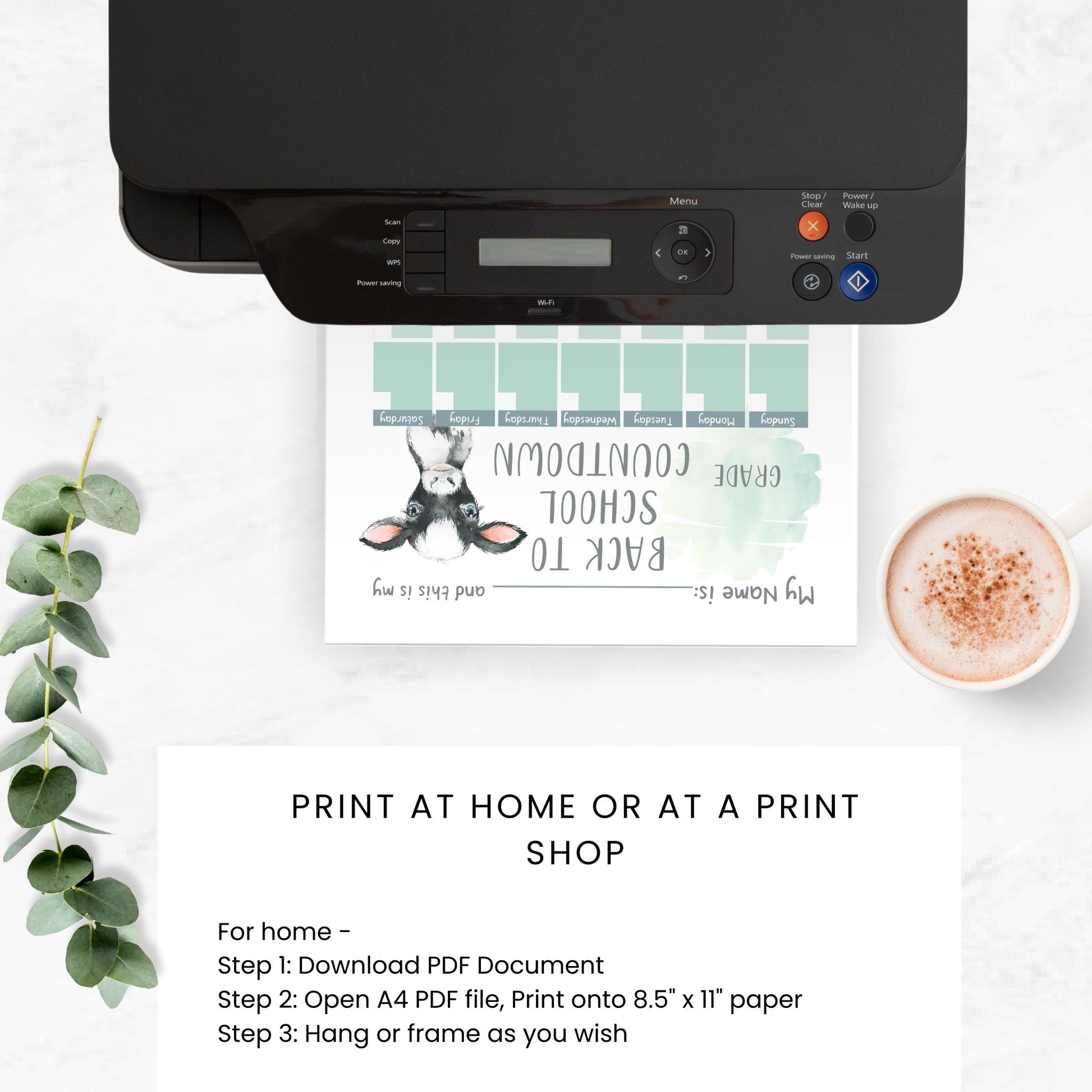 printer with the school countdown calendar ombre calf printing on the paper tray. coffee cup and plant stem on tabletop. Text on image states print at home or at a print shop.